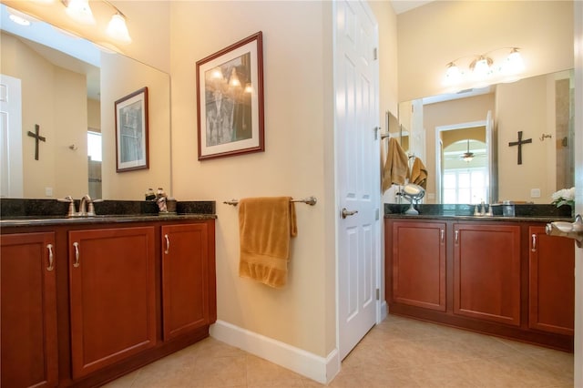 328 Siena Vista Pl, Sun City Center, FL 33573 - bathroom featuring a sink, baseboards, two vanities, and tile patterned floors
