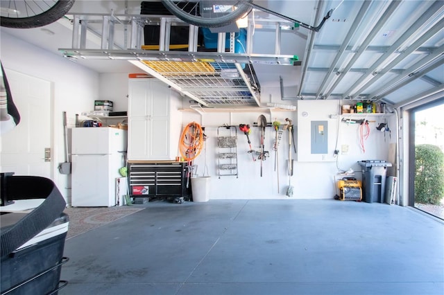 328 Siena Vista Pl, Sun City Center, FL 33573 - garage featuring freestanding refrigerator and electric panel