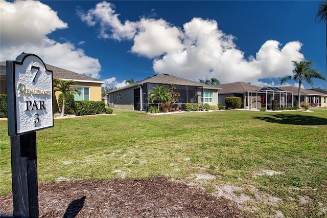 328 Siena Vista Pl, Sun City Center, FL 33573 - view of front of property with glass enclosure and a front yard