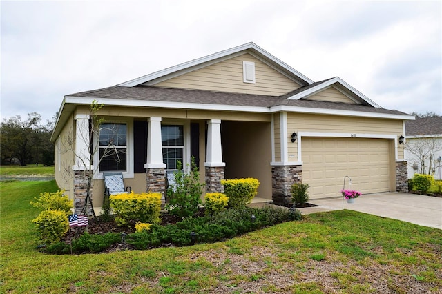 craftsman-style home featuring a porch, a garage, concrete driveway, stone siding, and a front yard