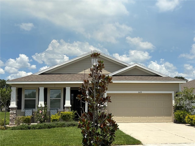 8438 Wheat Stone Dr, Zephyrhills, FL 33540 - craftsman house featuring driveway, a shingled roof, a front lawn, and a garage