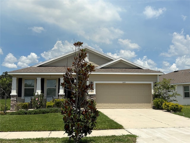 8438 Wheat Stone Dr, Zephyrhills, FL 33540 - view of front of house with driveway, an attached garage, a front lawn, and roof with shingles