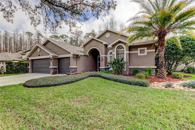 view of front facade with an attached garage, driveway, a front yard, and stucco siding