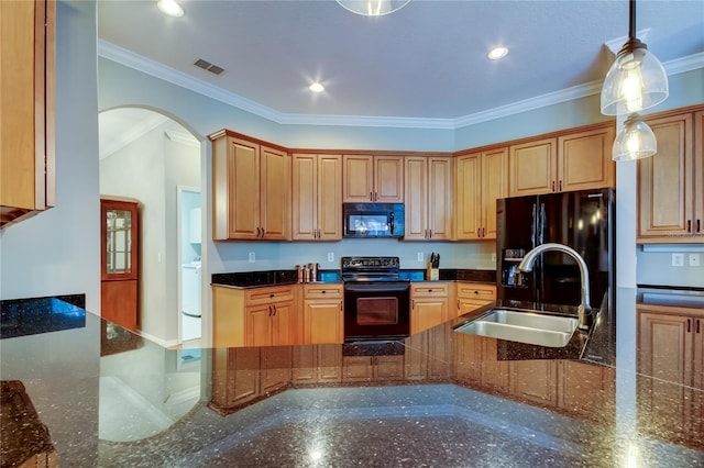 kitchen featuring crown molding, visible vents, a sink, and black appliances