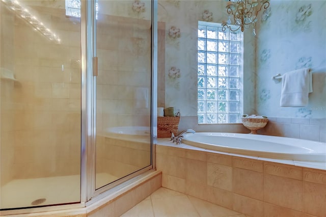 bathroom featuring a garden tub, a stall shower, tile patterned flooring, and wallpapered walls