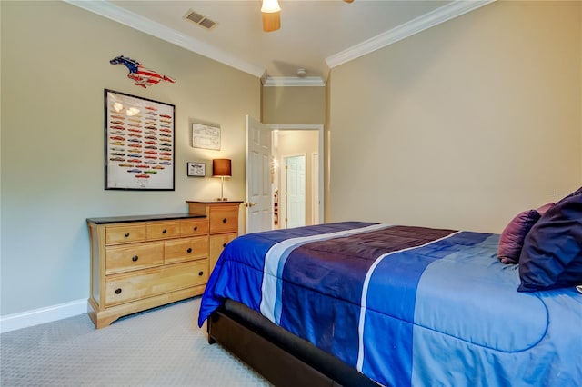 carpeted bedroom with a ceiling fan, visible vents, crown molding, and baseboards