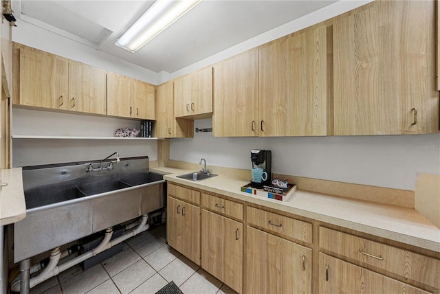 kitchen featuring light tile patterned floors, light countertops, open shelves, and light brown cabinetry