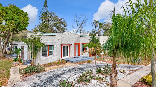 mediterranean / spanish-style home featuring crawl space and stucco siding