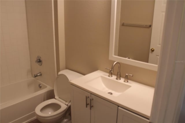 full bath featuring washtub / shower combination, vanity, and toilet