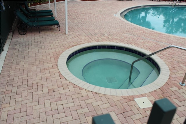 pool with a community hot tub