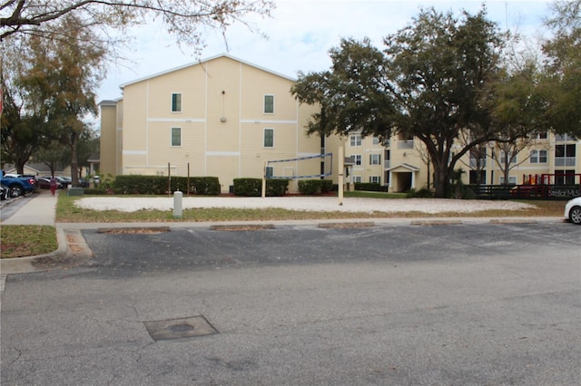 view of property with uncovered parking