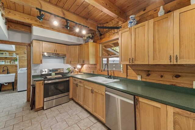 kitchen featuring washer / clothes dryer, a sink, wood walls, appliances with stainless steel finishes, and wooden ceiling