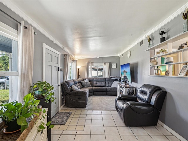 living area with light tile patterned floors, baseboards, visible vents, and crown molding