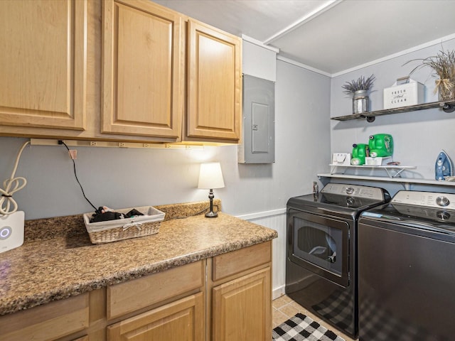 laundry room featuring a wainscoted wall, light tile patterned floors, cabinet space, electric panel, and independent washer and dryer