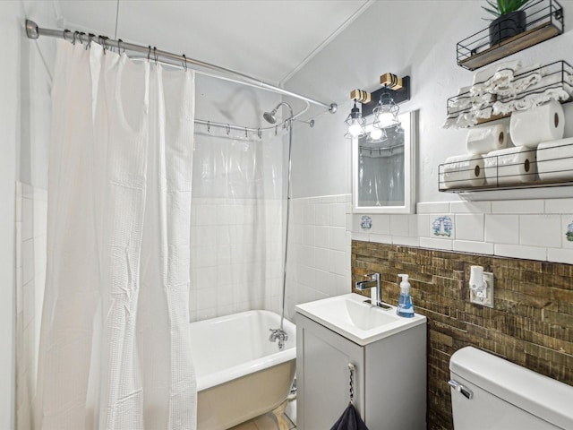 full bathroom with shower / bath combination with curtain, tile walls, toilet, and vanity