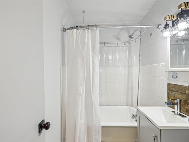 bathroom featuring shower / tub combo with curtain and vanity