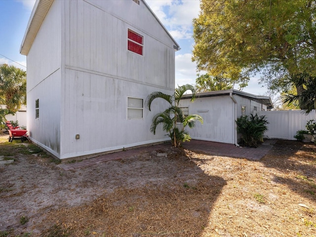 view of property exterior with fence