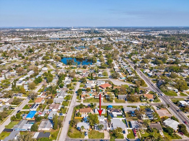 birds eye view of property featuring a residential view and a water view