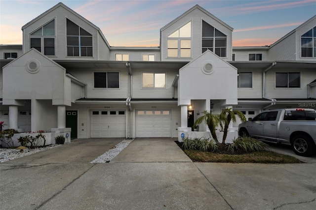 view of front of home featuring driveway and a garage