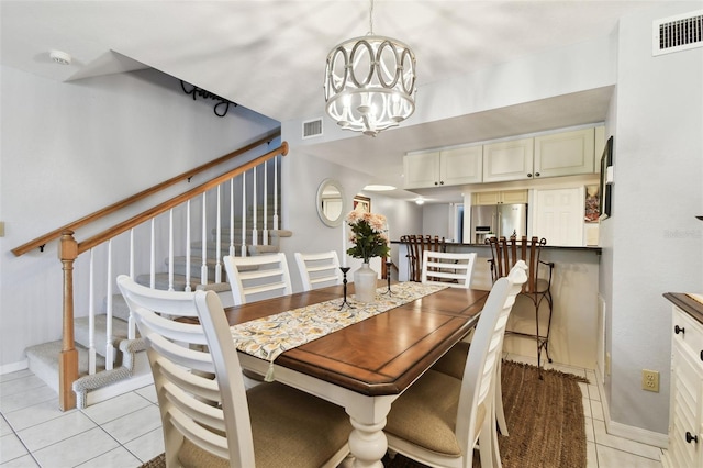 dining area featuring stairway, light tile patterned floors, visible vents, and a notable chandelier