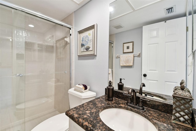 bathroom with toilet, a shower stall, visible vents, and vanity