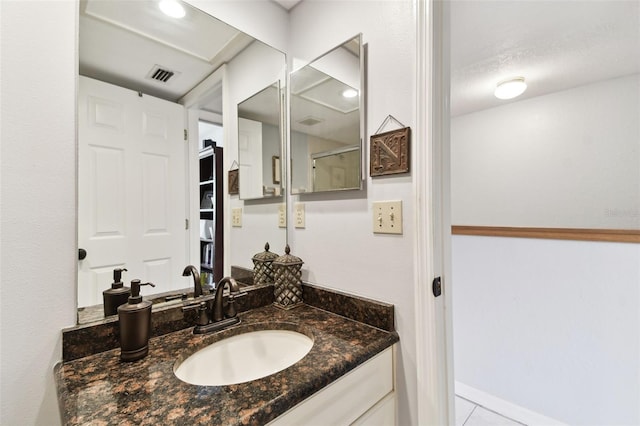 bathroom with visible vents and vanity