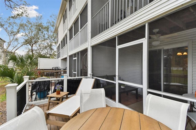 wooden deck featuring outdoor dining space