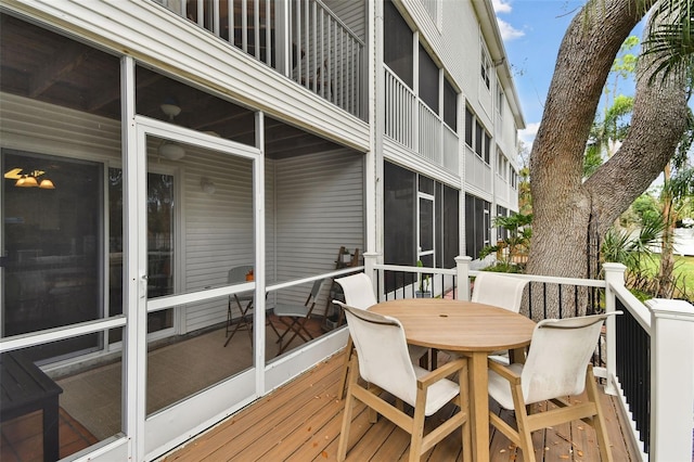 deck featuring outdoor dining area