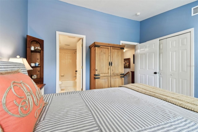 bedroom with connected bathroom, visible vents, and a closet