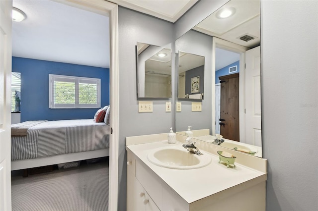 bathroom featuring ensuite bath, visible vents, and vanity