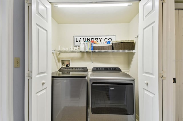 washroom featuring laundry area and washing machine and dryer