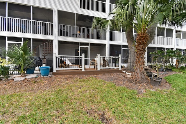 rear view of house with a yard