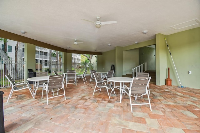 sunroom featuring a ceiling fan