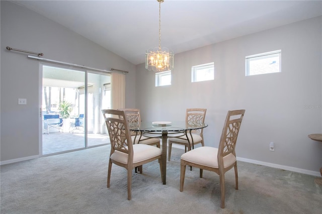 dining room with lofted ceiling, carpet, and baseboards