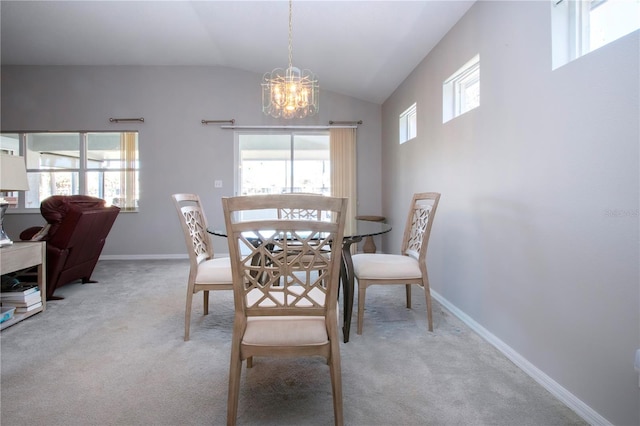 dining room featuring baseboards, plenty of natural light, carpet, and an inviting chandelier