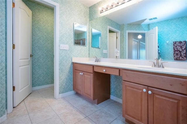 full bath with tile patterned flooring, double vanity, wallpapered walls, and a sink