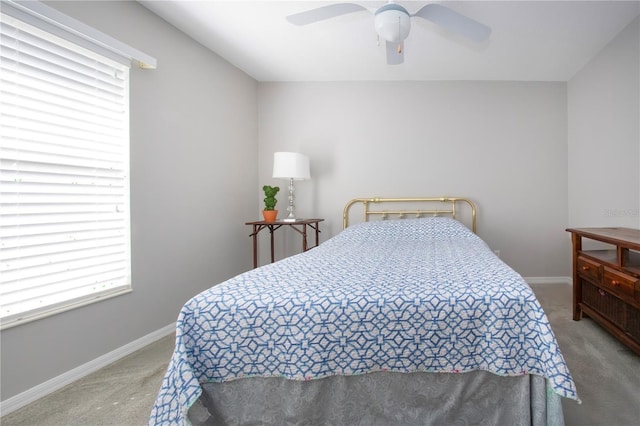 bedroom featuring baseboards, carpet floors, and ceiling fan