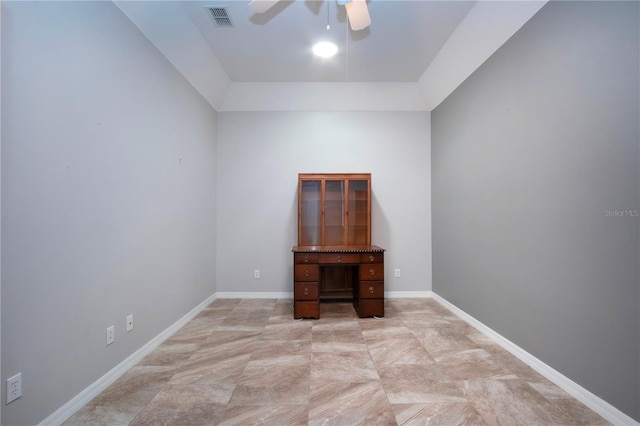 empty room featuring visible vents, baseboards, and ceiling fan