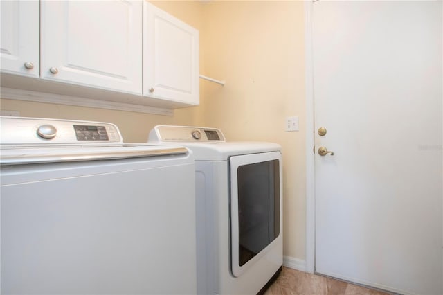 laundry area featuring cabinet space and washing machine and dryer