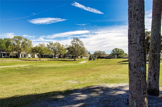 surrounding community featuring a lawn