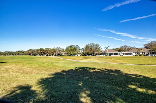 view of home's community featuring a lawn