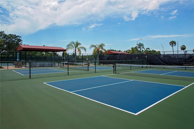 view of sport court featuring community basketball court and fence