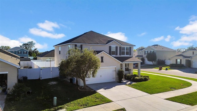 traditional-style home featuring driveway, a residential view, a gate, a front lawn, and stucco siding