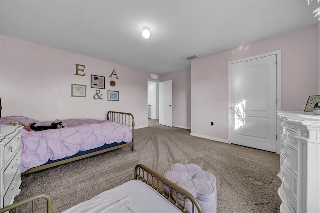 bedroom with baseboards, visible vents, and carpet flooring