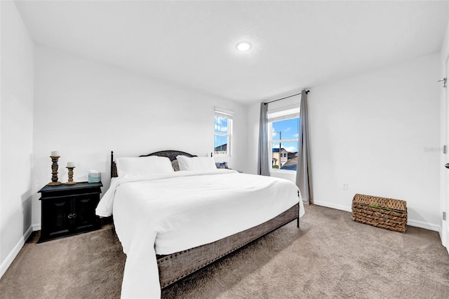 bedroom with carpet and baseboards