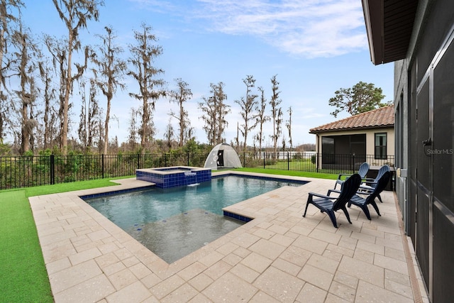 view of swimming pool with a patio area, a fenced backyard, and a pool with connected hot tub