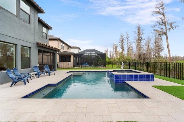 view of pool with a patio area, a fenced backyard, and a pool with connected hot tub