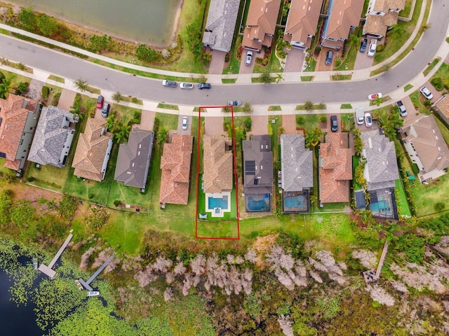 birds eye view of property with a residential view