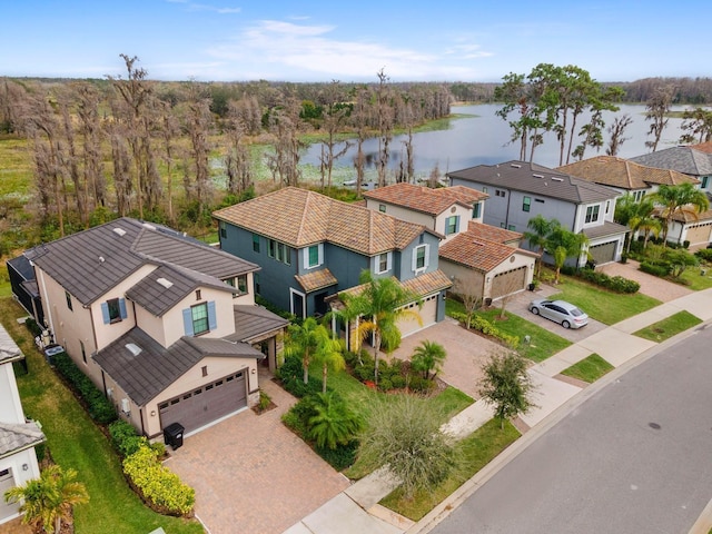 bird's eye view featuring a residential view and a water view