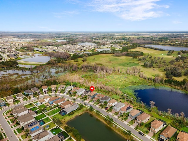 drone / aerial view featuring a water view and a residential view